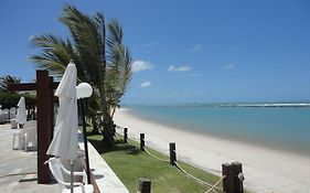 Flat equipado e com varanda no melhor trecho da praia de Muro Alto, beira-mar, piscina, restaurante, wi-fi, a 10 minutos de carro de Porto de Galinhas